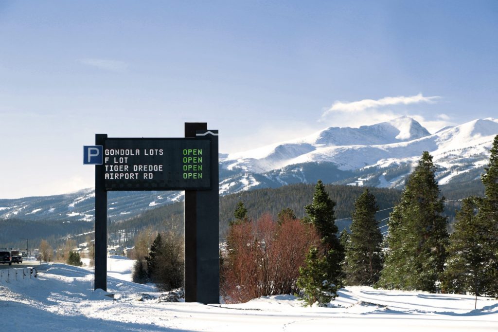 Dynamic sign outside Breckenridge, with mountain in background