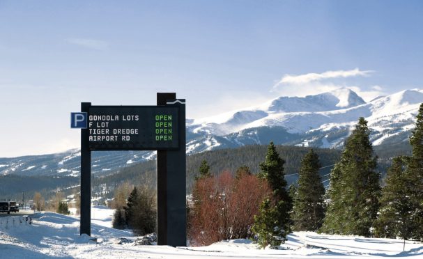 Dynamic sign outside Breckenridge, with mountain in background