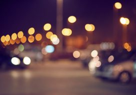 An urban parking lot at night, out of focus