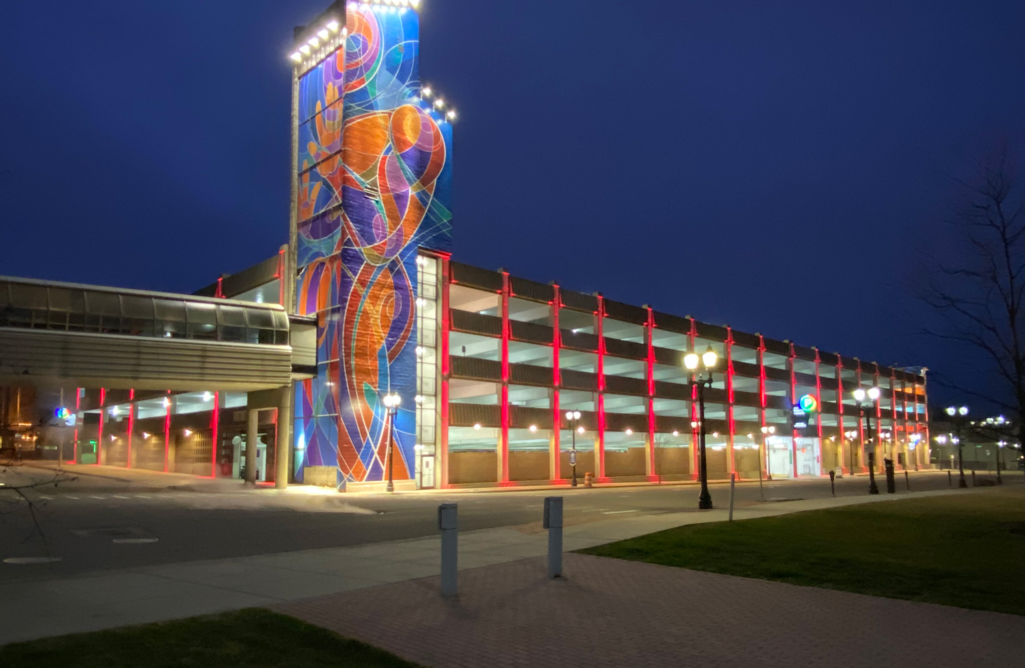 Exterior of Lansing parking structure at night after "extreme makeover"