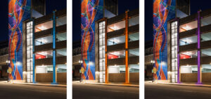 Examples of multiple architectural lighting color schemes on North Grand Ramp: Blue, orange, and purple