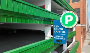 Renovated facade of South Capitol Ramp in Lansing with new green metal panels and distinctive signage