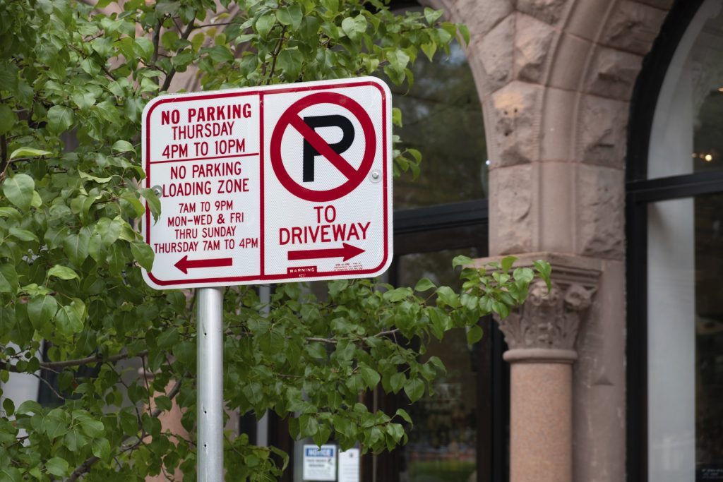 Detail of "No Parking" signs on a city street