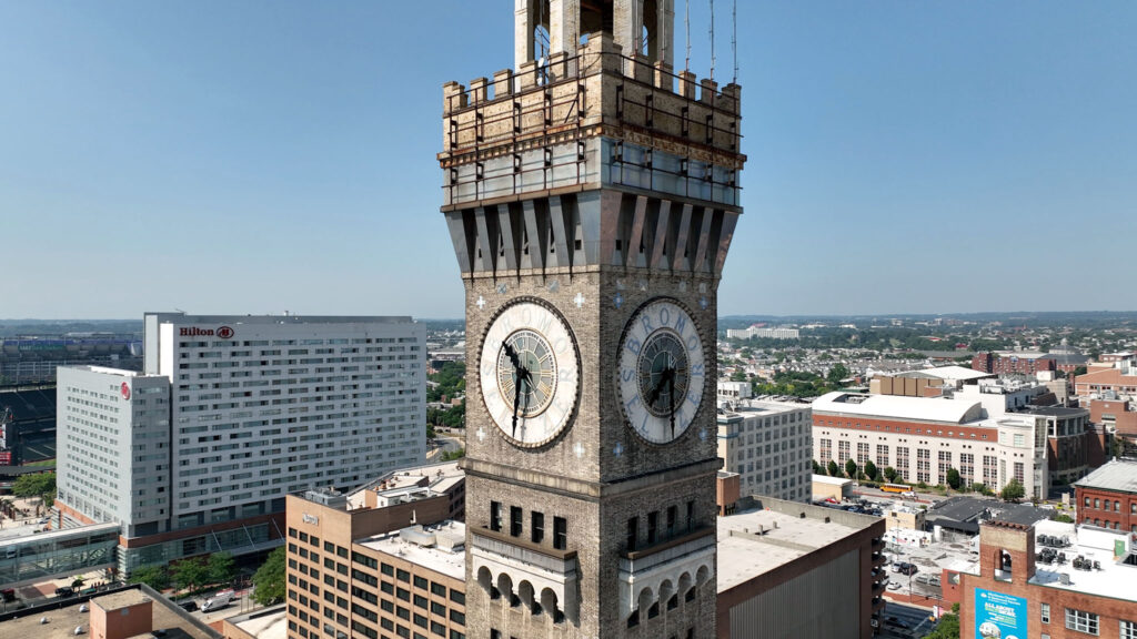 Aerial view of the clocks on the Bromo Seltzer Arts Tower, a historic brick clock tower in Baltimore