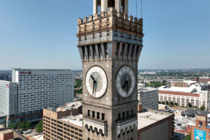 Aerial view of the clocks on the Bromo Seltzer Arts Tower, a historic brick clock tower in Baltimore